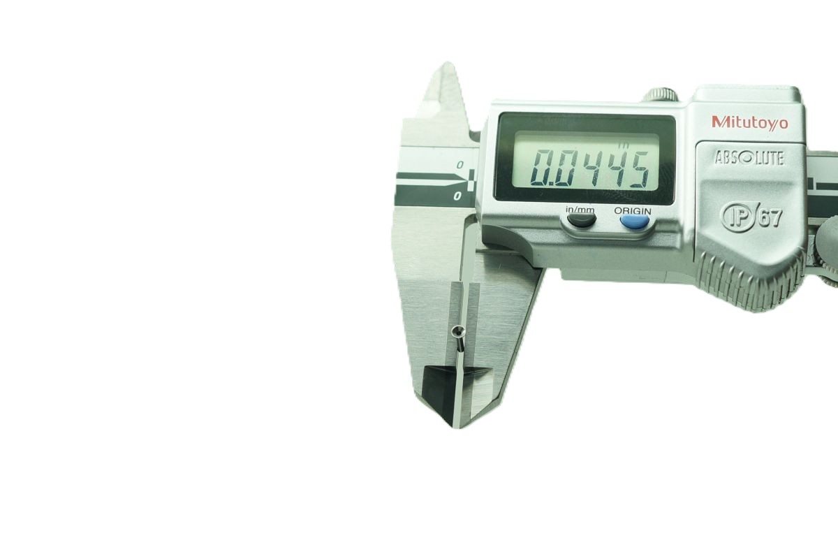 Quality Control Measurement with Mitutoyo Caliper – VF Decolletage - VF Decolletage VF Decolletage QC staff measuring precision part with Mitutoyo digital caliper
